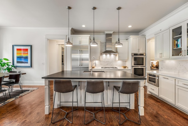 1727 Hillmont Dr, Nashville, TN 37215 - kitchen featuring wall chimney exhaust hood, stainless steel appliances, crown molding, tasteful backsplash, and glass insert cabinets