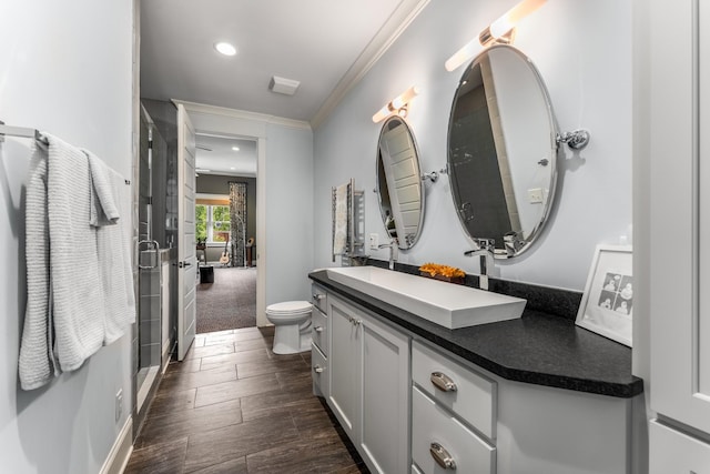 1727 Hillmont Dr, Nashville, TN 37215 - bathroom with vanity, crown molding, a shower stall, wood finished floors, and recessed lighting