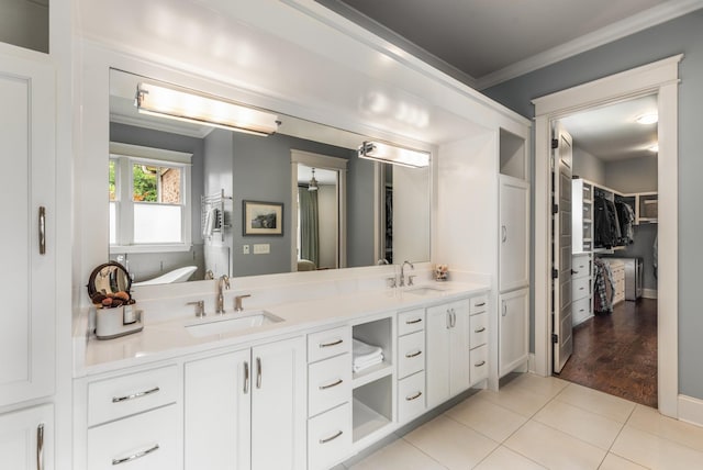 1727 Hillmont Dr, Nashville, TN 37215 - full bathroom with ornamental molding, double vanity, a walk in closet, and tile patterned floors