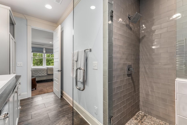 1727 Hillmont Dr, Nashville, TN 37215 - ensuite bathroom with wood finished floors, a stall shower, vanity, recessed lighting, and ornamental molding