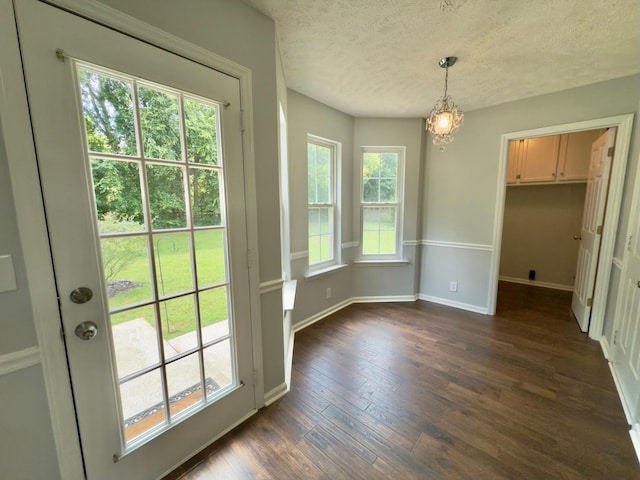 213 Ramsey Rd, Murfreesboro, TN 37127 - unfurnished dining area with a textured ceiling, a chandelier, and dark wood-type flooring