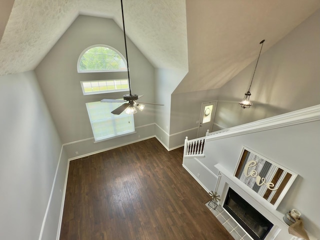 213 Ramsey Rd, Murfreesboro, TN 37127 - unfurnished living room featuring lofted ceiling, wood finished floors, a ceiling fan, and a textured ceiling