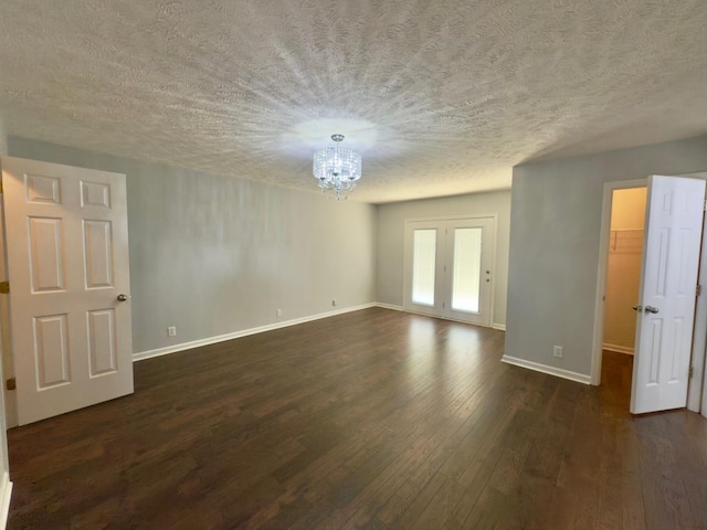 213 Ramsey Rd, Murfreesboro, TN 37127 - spare room with a chandelier, dark wood-type flooring, and a textured ceiling
