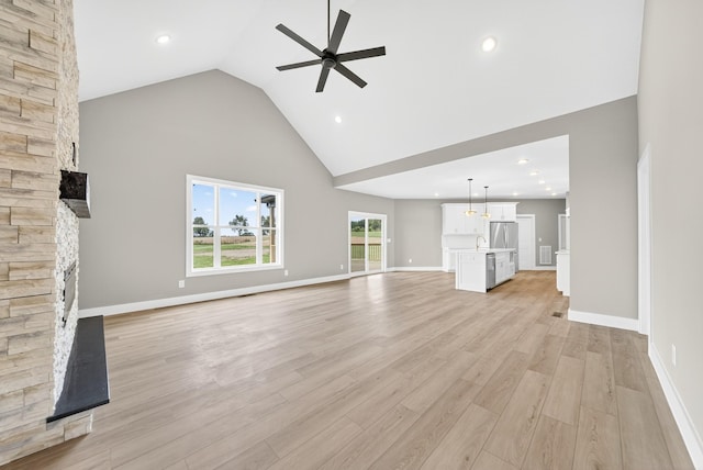 1263 N Sumner Rd, Bethpage, TN 37022 - unfurnished living room with a ceiling fan, a fireplace, high vaulted ceiling, light wood finished floors, and recessed lighting