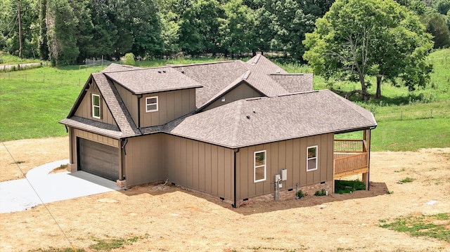 1263 N Sumner Rd, Bethpage, TN 37022 - view of front of home with a shingled roof, concrete driveway, board and batten siding, crawl space, and a garage