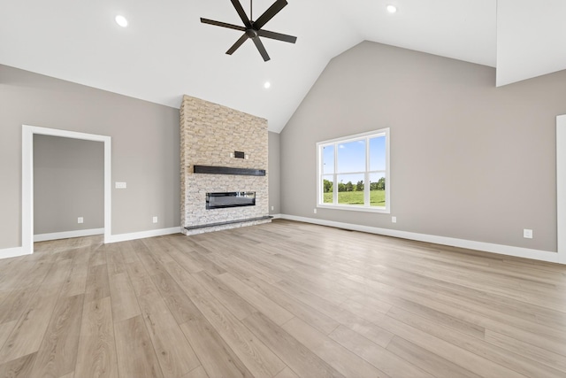 1263 N Sumner Rd, Bethpage, TN 37022 - unfurnished living room with ceiling fan, high vaulted ceiling, a fireplace, light wood-style floors, and recessed lighting