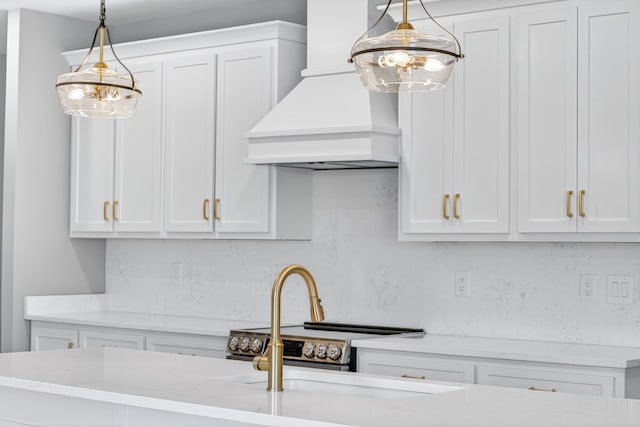 1263 N Sumner Rd, Bethpage, TN 37022 - kitchen with custom exhaust hood, decorative backsplash, hanging light fixtures, and white cabinetry