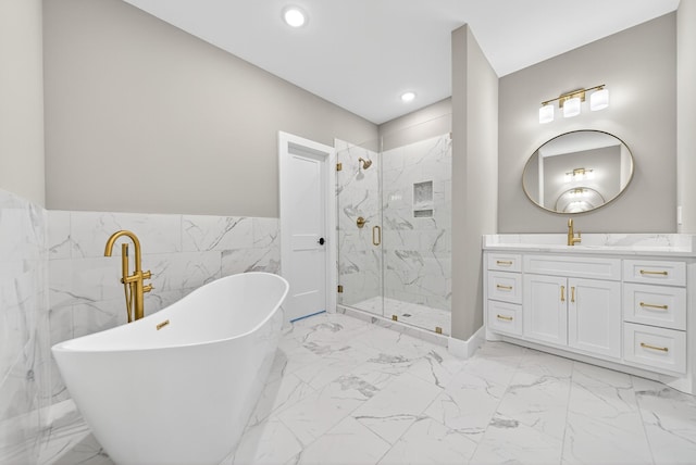 1263 N Sumner Rd, Bethpage, TN 37022 - full bathroom with marble finish floors, a marble finish shower, tile walls, a freestanding tub, and vanity
