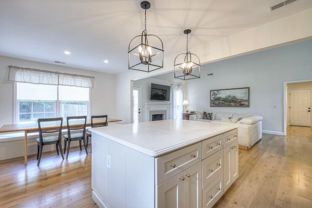 2808 Lafayette Dr, Thompsons Station, TN 37179 - kitchen with a chandelier, open floor plan, light wood-style floors, a center island, and pendant lighting