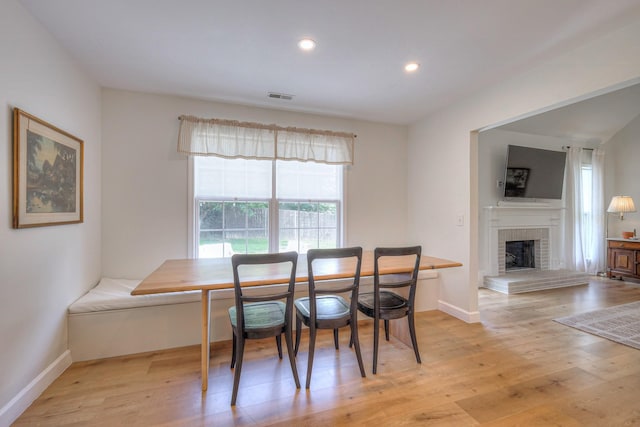 2808 Lafayette Dr, Thompsons Station, TN 37179 - dining room with light wood-style floors, a brick fireplace, recessed lighting, and breakfast area