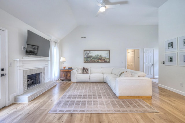 2808 Lafayette Dr, Thompsons Station, TN 37179 - living area with ceiling fan, a fireplace, light wood-style flooring, and high vaulted ceiling