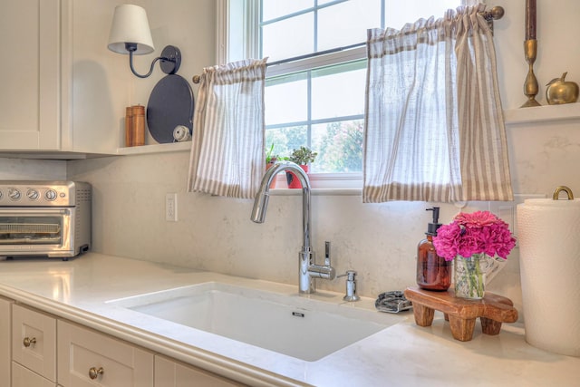 2808 Lafayette Dr, Thompsons Station, TN 37179 - kitchen with white cabinetry and light countertops