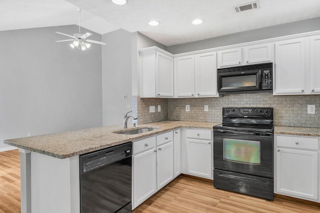 3313 Monoco Dr, Spring Hill, TN 37174 - kitchen featuring black appliances, a ceiling fan, a peninsula, light wood-style flooring, and white cabinetry