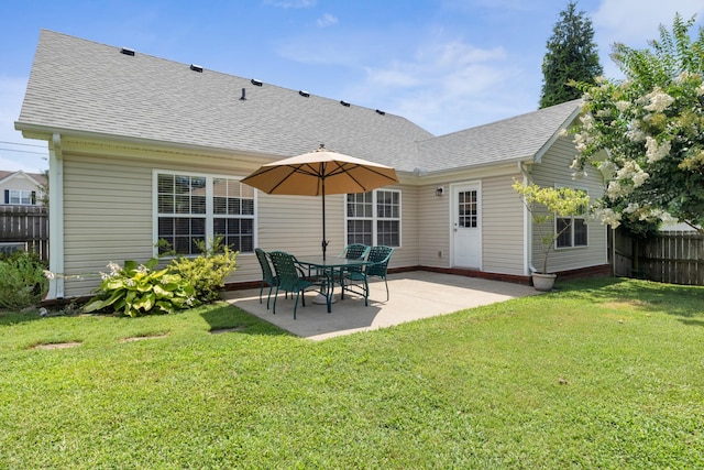 3313 Monoco Dr, Spring Hill, TN 37174 - rear view of property featuring roof with shingles and a patio