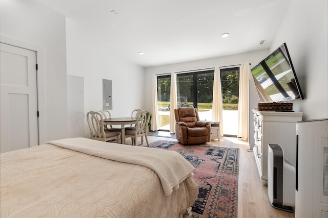 1020 Loggins Rd, Charlotte, TN 37036 - bedroom featuring access to outside, light wood finished floors, electric panel, and recessed lighting