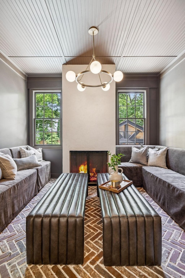 3404 Benham Ave, Nashville, TN 37215 - living area with a chandelier, brick floors, plenty of natural light, and ornamental molding