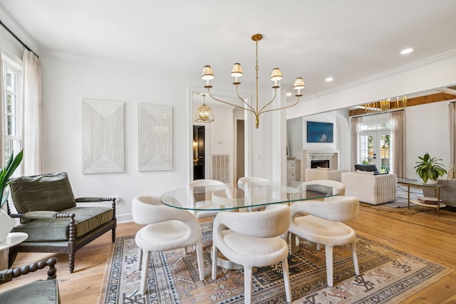 3404 Benham Ave, Nashville, TN 37215 - dining room featuring ornamental molding, wood finished floors, a chandelier, a fireplace, and recessed lighting