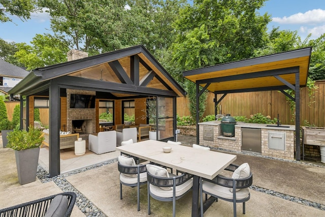 3404 Benham Ave, Nashville, TN 37215 - view of patio featuring an outdoor brick fireplace, an outdoor kitchen, a gazebo, and outdoor dining space