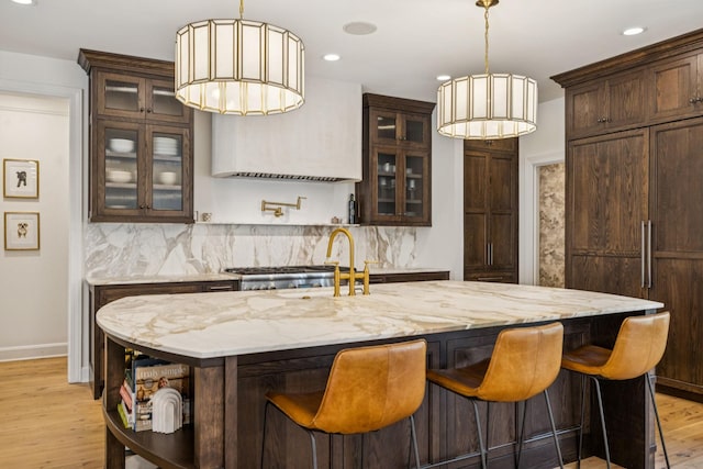 3404 Benham Ave, Nashville, TN 37215 - bar area with light wood-style flooring, backsplash, recessed lighting, and hanging light fixtures