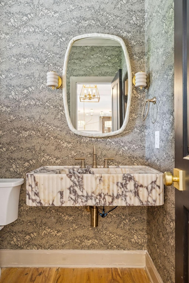 3404 Benham Ave, Nashville, TN 37215 - bathroom with wallpapered walls and wood finished floors