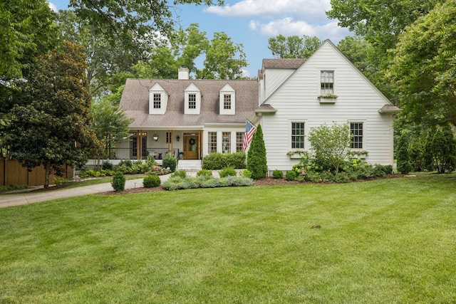 3404 Benham Ave, Nashville, TN 37215 - cape cod home featuring a front lawn, a porch, and a chimney