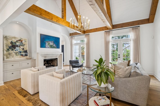 3404 Benham Ave, Nashville, TN 37215 - living room featuring french doors, a chandelier, beam ceiling, high vaulted ceiling, and wood finished floors
