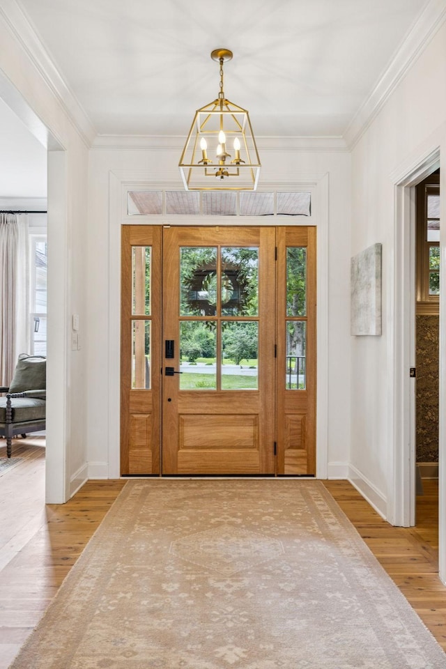 3404 Benham Ave, Nashville, TN 37215 - foyer entrance with wood finished floors, ornamental molding, and a chandelier