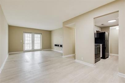 420 Elysian Fields Rd Unit E4, Nashville, TN 37211 - unfurnished living room with light wood-style floors and baseboards