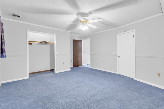 1811 Angel Ln, Signal Mountain, TN 37377 - unfurnished bedroom featuring a textured ceiling, crown molding, carpet flooring, a closet, and ceiling fan