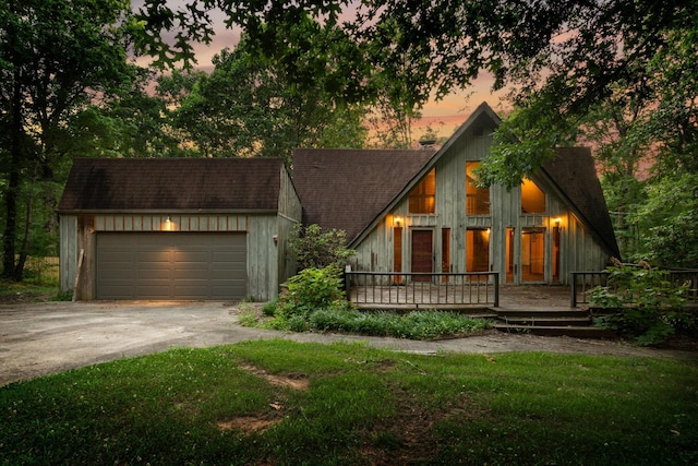 1811 Angel Ln, Signal Mountain, TN 37377 - a-frame style home with concrete driveway, a garage, an outdoor structure, and roof with shingles