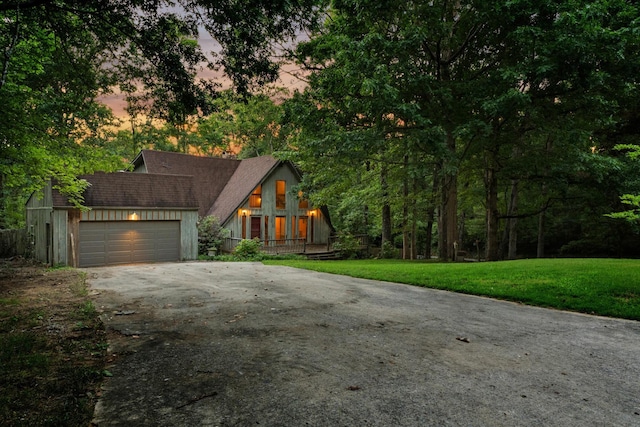 1811 Angel Ln, Signal Mountain, TN 37377 - a-frame style home featuring concrete driveway, a garage, and a front yard