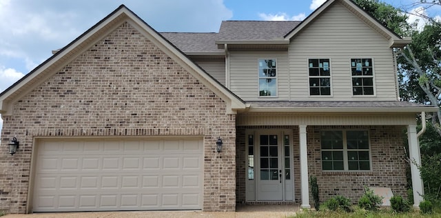 1170 Rimrock Rd, Smyrna, TN 37167 - view of front of property with brick siding, a porch, roof with shingles, a garage, and driveway