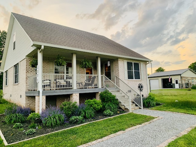 1371 Verona Caney Rd, Lewisburg, TN 37091 - view of front of home featuring a porch, brick siding, a front lawn, a shingled roof, and stairs