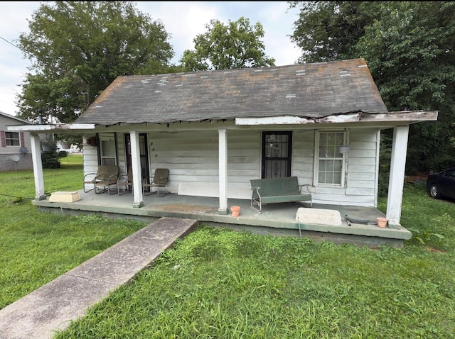 209 Olive St, Mount Pleasant, TN 38474 - view of front of house featuring covered porch and a front yard