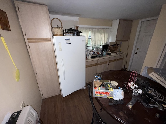 209 Olive St, Mount Pleasant, TN 38474 - kitchen with freestanding refrigerator and dark wood-style floors