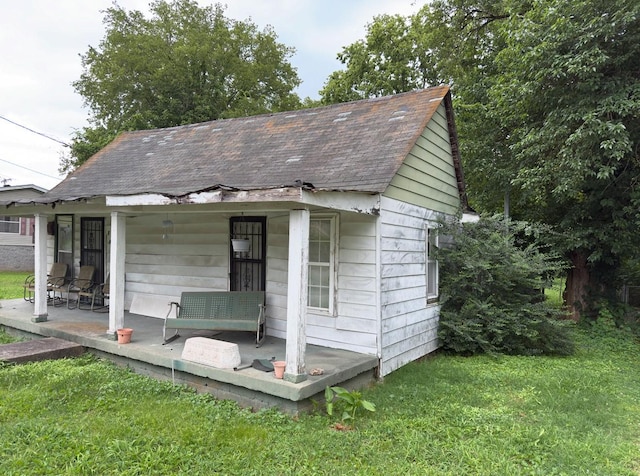 209 Olive St, Mount Pleasant, TN 38474 - view of outbuilding featuring covered porch