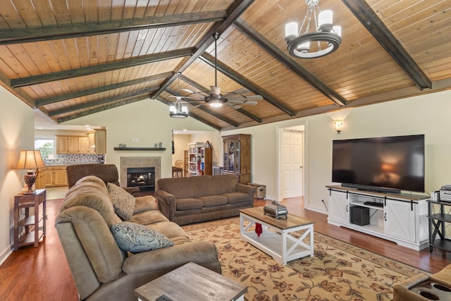 2680 Cedar Grove Rd, Lebanon, TN 37087 - living room featuring wood ceiling, wood finished floors, a ceiling fan, a fireplace, and a chandelier