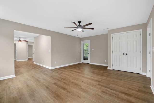 1615 Mohawk Trl, Hopkinsville, KY 42240 - unfurnished living room featuring a ceiling fan and wood finished floors
