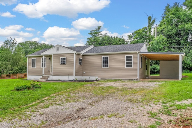1615 Mohawk Trl, Hopkinsville, KY 42240 - back of house with an attached carport, driveway, and a shingled roof