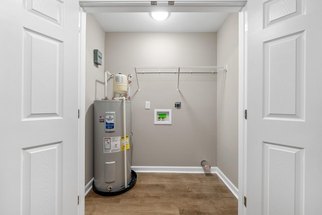 1615 Mohawk Trl, Hopkinsville, KY 42240 - washroom with electric water heater, electric dryer hookup, wood finished floors, and hookup for a washing machine