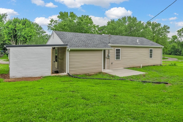 1615 Mohawk Trl, Hopkinsville, KY 42240 - rear view of house featuring a patio, a yard, and a shingled roof