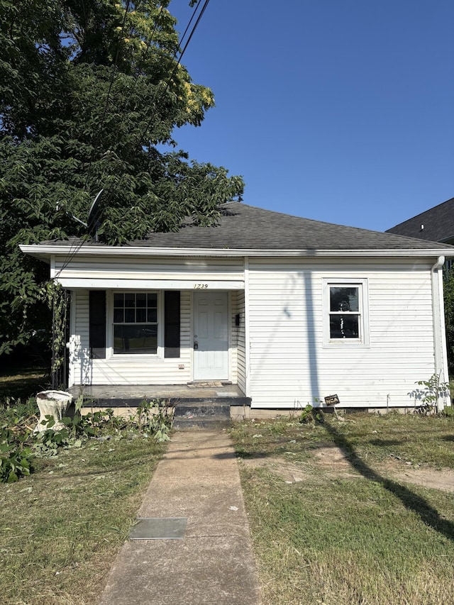 1739 Dr Db Todd Jr Blvd, Nashville, TN 37208 - bungalow-style house with covered porch, a shingled roof, and a front yard