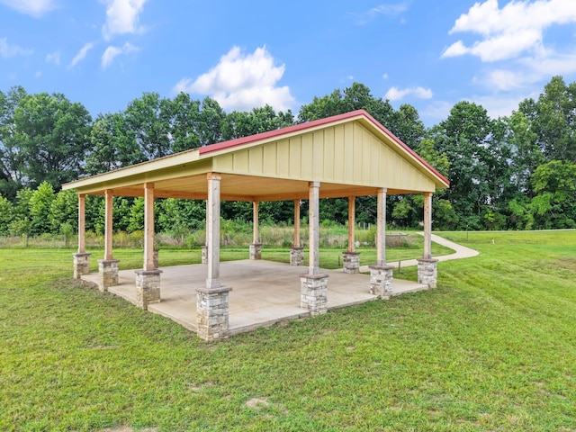611 Hawkeye Ct, Eagleville, TN 37060 - view of community with a lawn, a patio, and view of scattered trees