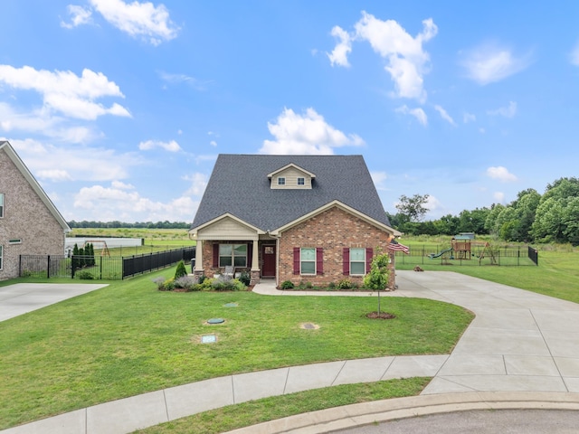 611 Hawkeye Ct, Eagleville, TN 37060 - view of front facade featuring brick siding, driveway, a playground, and a shingled roof