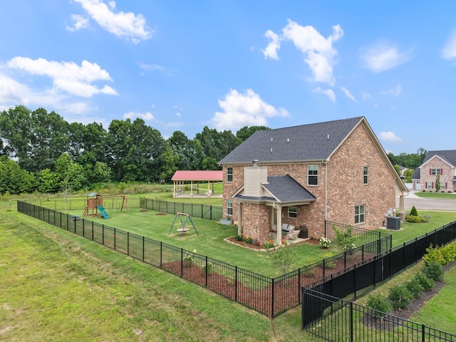 611 Hawkeye Ct, Eagleville, TN 37060 - back of house featuring a playground, brick siding, and a fenced backyard