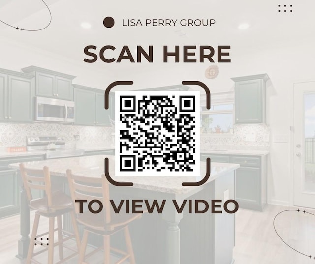 611 Hawkeye Ct, Eagleville, TN 37060 - kitchen with white microwave, stove, a breakfast bar area, decorative backsplash, and a center island