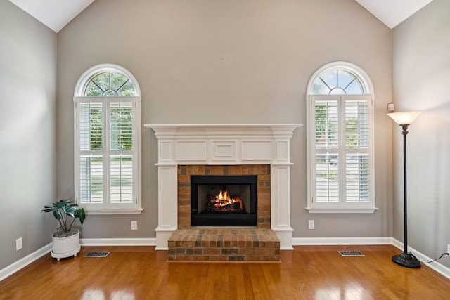 2707 Albany Ct, Murfreesboro, TN 37129 - unfurnished living room featuring hardwood / wood-style floors, a fireplace, and high vaulted ceiling
