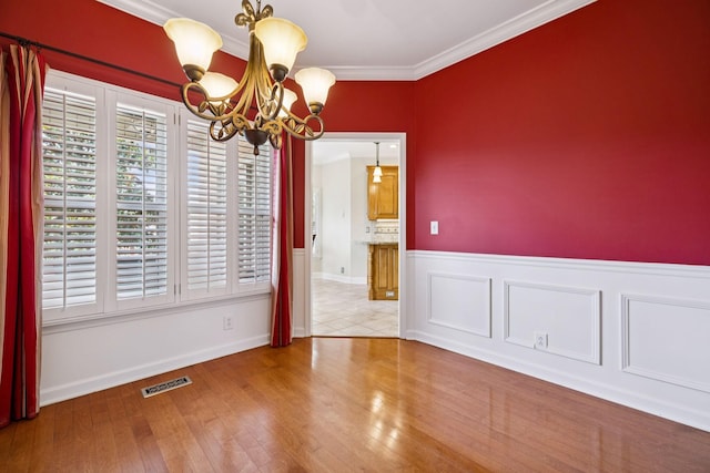 2707 Albany Ct, Murfreesboro, TN 37129 - unfurnished dining area featuring a chandelier, ornamental molding, and wood finished floors
