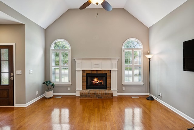 2707 Albany Ct, Murfreesboro, TN 37129 - unfurnished living room with wood finished floors, healthy amount of natural light, ceiling fan, a brick fireplace, and high vaulted ceiling