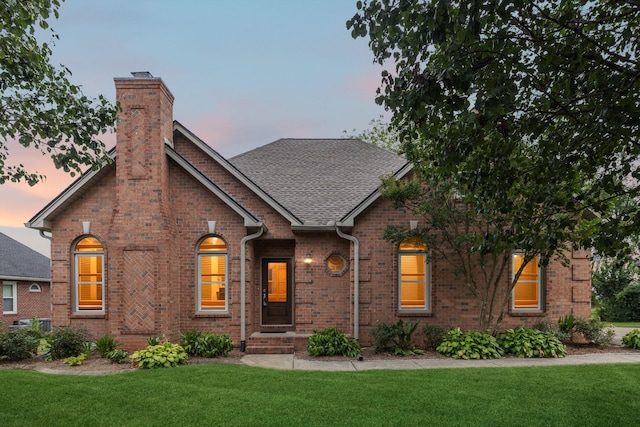 2707 Albany Ct, Murfreesboro, TN 37129 - view of front facade with brick siding, a front lawn, a chimney, and a shingled roof